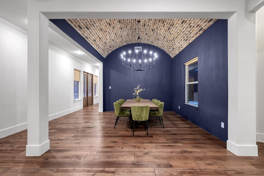 Ample space in the Dinning with a brick barrel ceiling lite by a 16 candle chandelier.