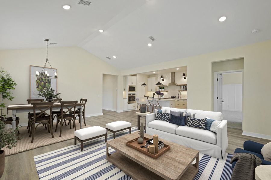 Open concept living spaces with vaulted ceiling
