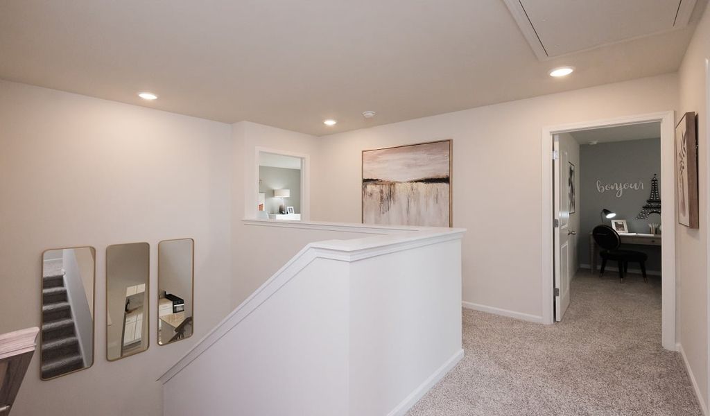 Stairway leads to four spacious bedrooms.