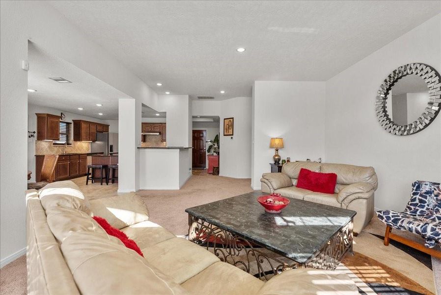 The living room features a cozy fireplace and is bathed in natural morning light through an abundance of windows The living room features a cozy fireplace and is bathed in natural morning light through an abundance of windows