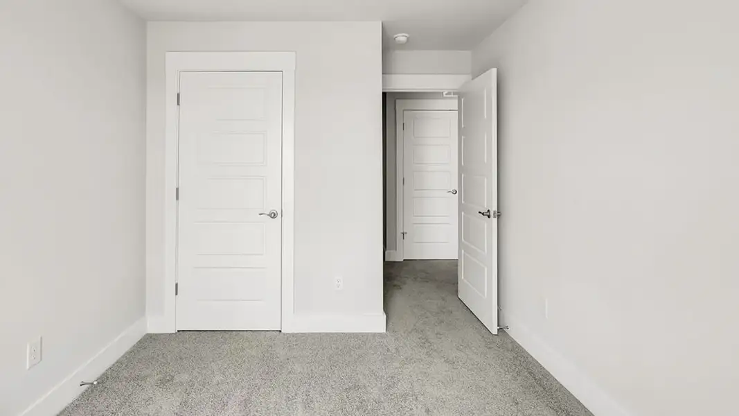 Spacious, unfurnished interior of a new home in The Cove at Indigo Preserve Townhomes, Leland (Image 16).