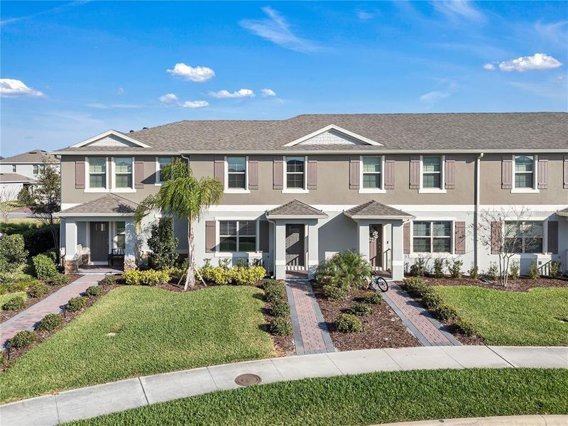 Front exterior of a new home in , Winter Garden, FL, highlighting curb appeal (Image 20).