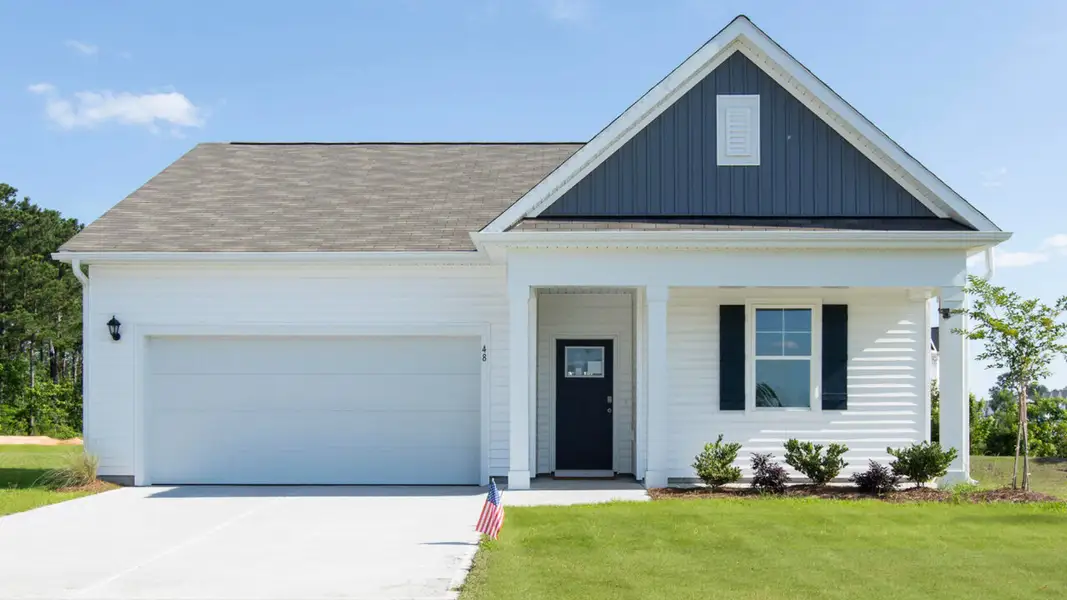 Front exterior of a new home in Grayson Park, Leland, NC, highlighting curb appeal (Image 1). Front exterior of a new home in Grayson Park, Leland, NC, highlighting curb appeal (Image 1).