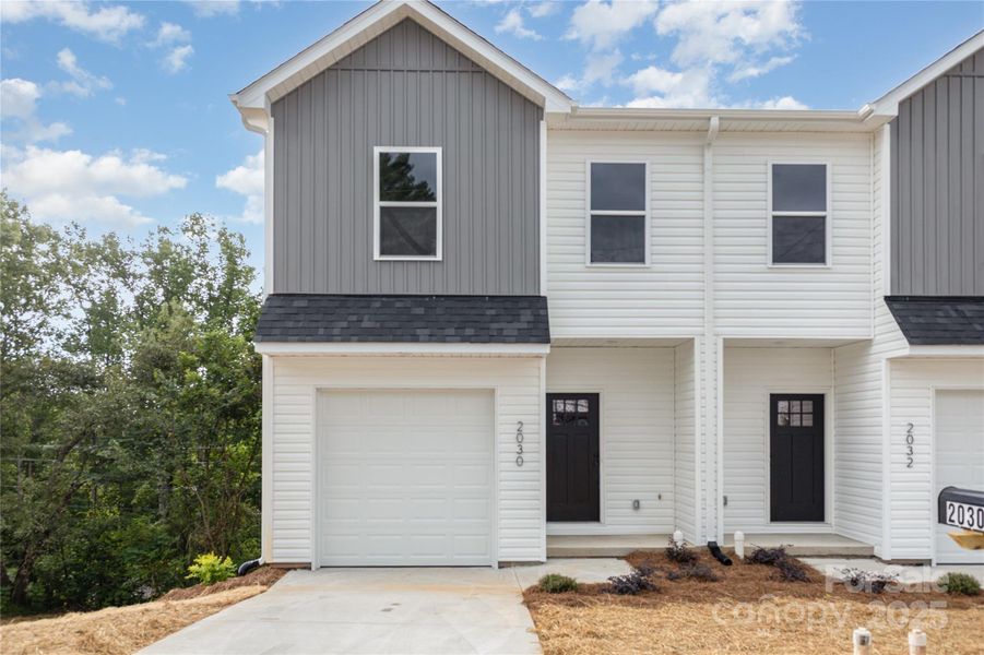 Front exterior of a new home in , Hickory, NC, highlighting curb appeal (Image 19).