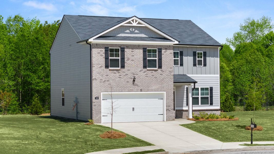 Front exterior of a new home in Locust Grove Station - Cedar Ridge, Locust Grove, GA, highlighting curb appeal (Image 1). Front exterior of a new home in Locust Grove Station - Cedar Ridge, Locust Grove, GA, highlighting curb appeal (Image 1).
