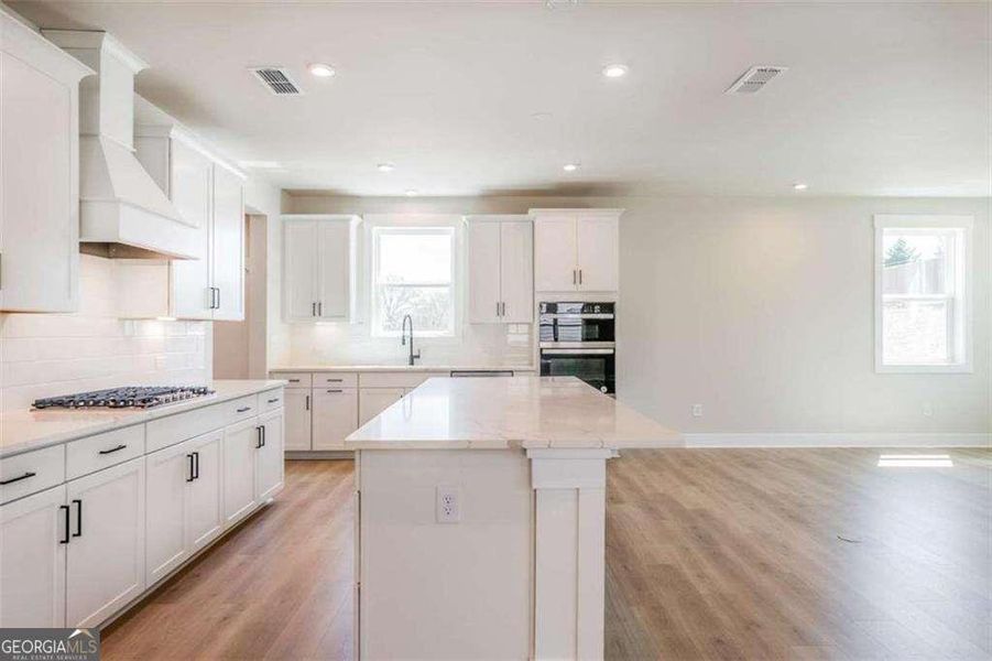 Furnished interior view inside a new home in The Paddocks at Doc Hughes, Buford (Image 7).