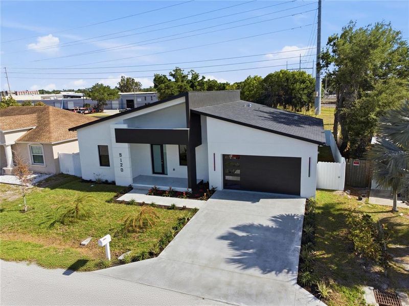 Front exterior of a new home in , Pinellas Park, FL, highlighting curb appeal (Image 27).