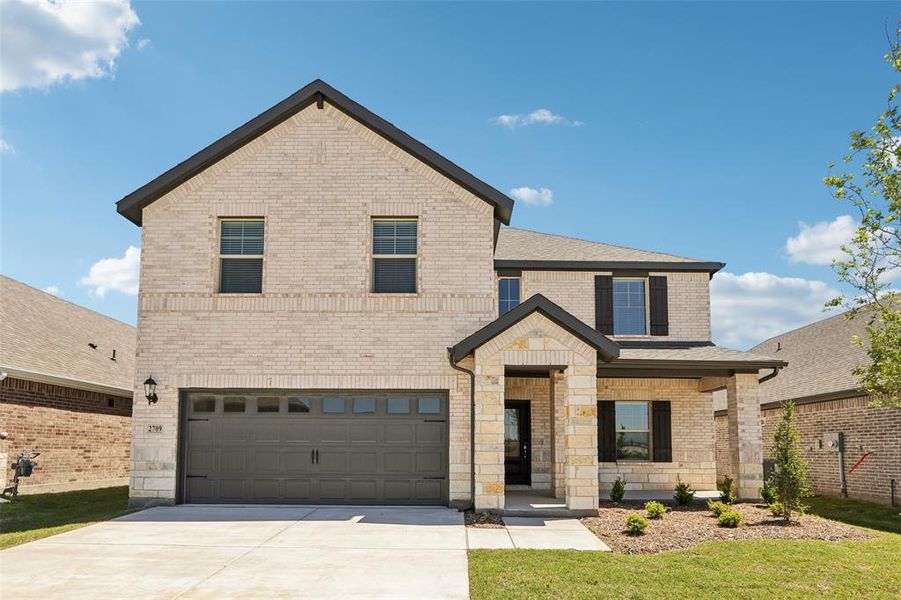 Front exterior of a new home in Parks at Foster Crossing - Premier Series, Anna, TX, highlighting curb appeal (Image 1). Front exterior of a new home in Parks at Foster Crossing - Premier Series, Anna, TX, highlighting curb appeal (Image 1).