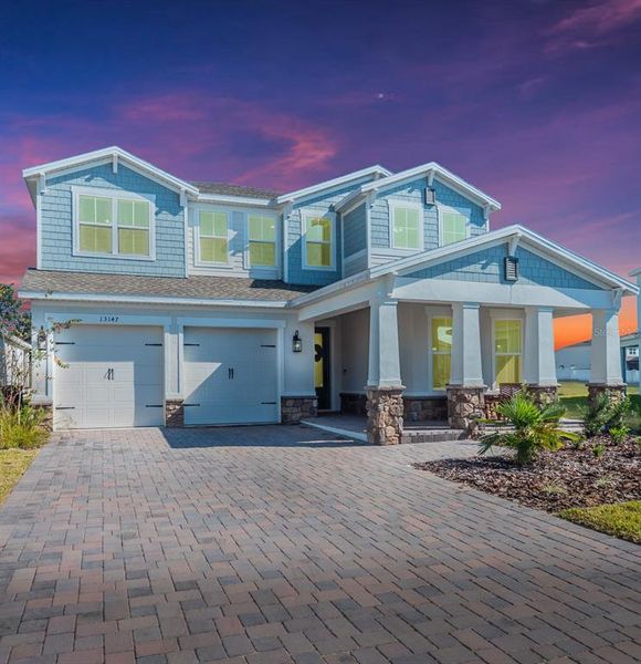Front exterior of a new home in , Winter Garden, FL, highlighting curb appeal (Image 26). Front exterior of a new home in , Winter Garden, FL, highlighting curb appeal (Image 26).
