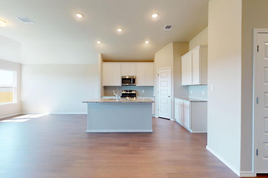 Furnished interior view inside a new home in Carillon, Manor (Image 6).