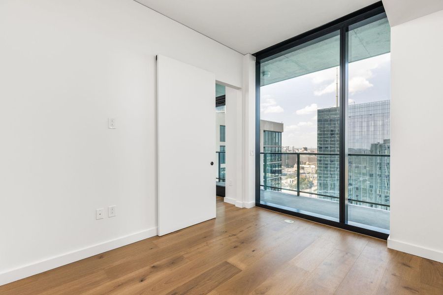 City skyline views from this sun-drenched bedroom.