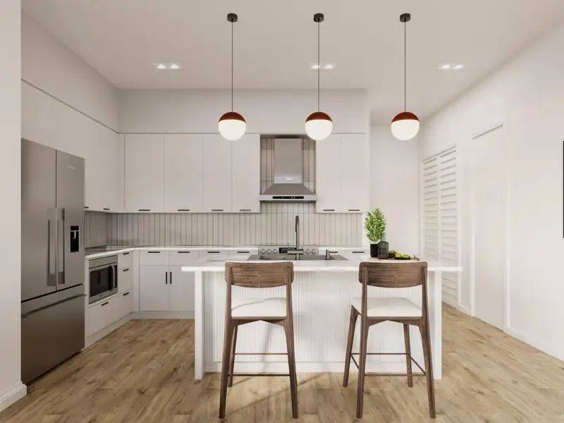 Kitchen featuring modern cabinets, wall chimney range hood, appliances with stainless steel finishes, and light wood-style floors