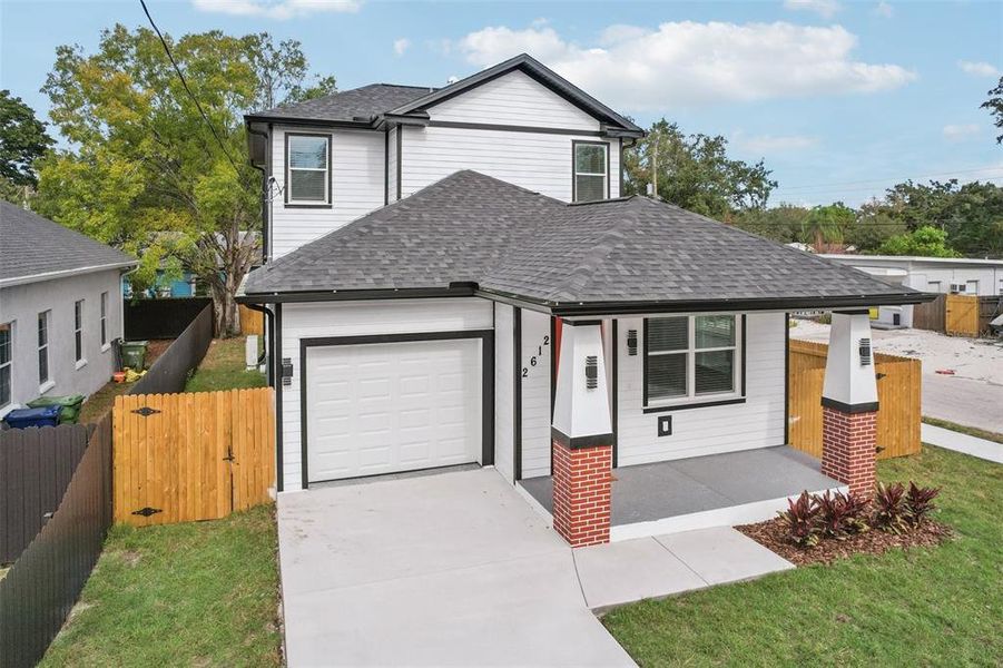 Front exterior of a new home in , Tampa, FL, highlighting curb appeal (Image 27).