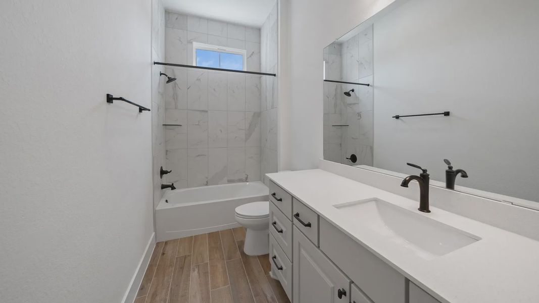 Representative furnished interior of a home built from the Waterloo by Chesmar Homes in Attwater 65's, Waller (Image 12).