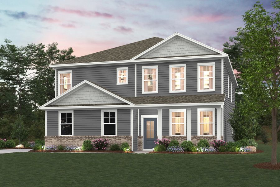 A house with a lawn in front of it.