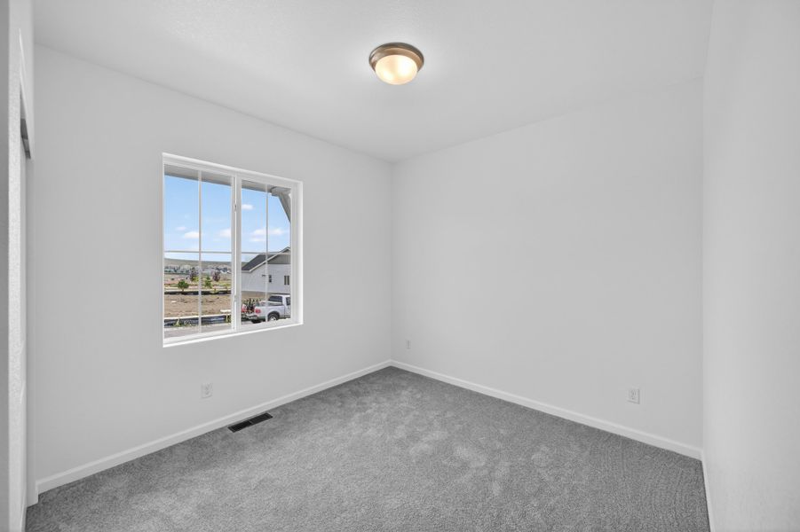 Spacious, unfurnished interior of a new home in Trailstone, Arvada (Image 20).
