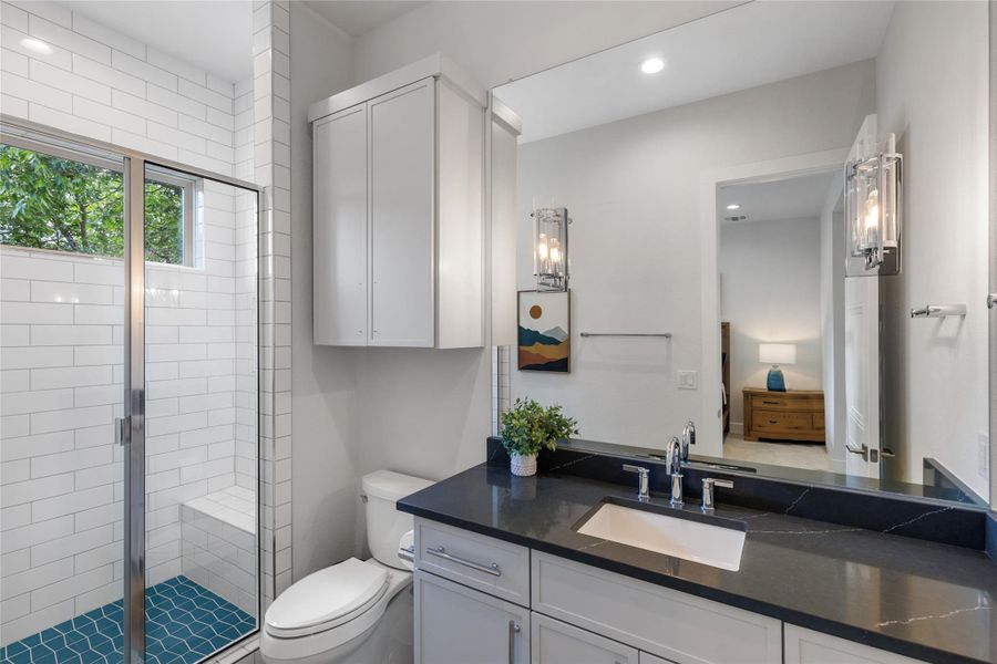 Bathroom 4 en-suite with vanity, a walk-in shower, and recessed lighting. Bathroom 4 en-suite with vanity, a walk-in shower, and recessed lighting.