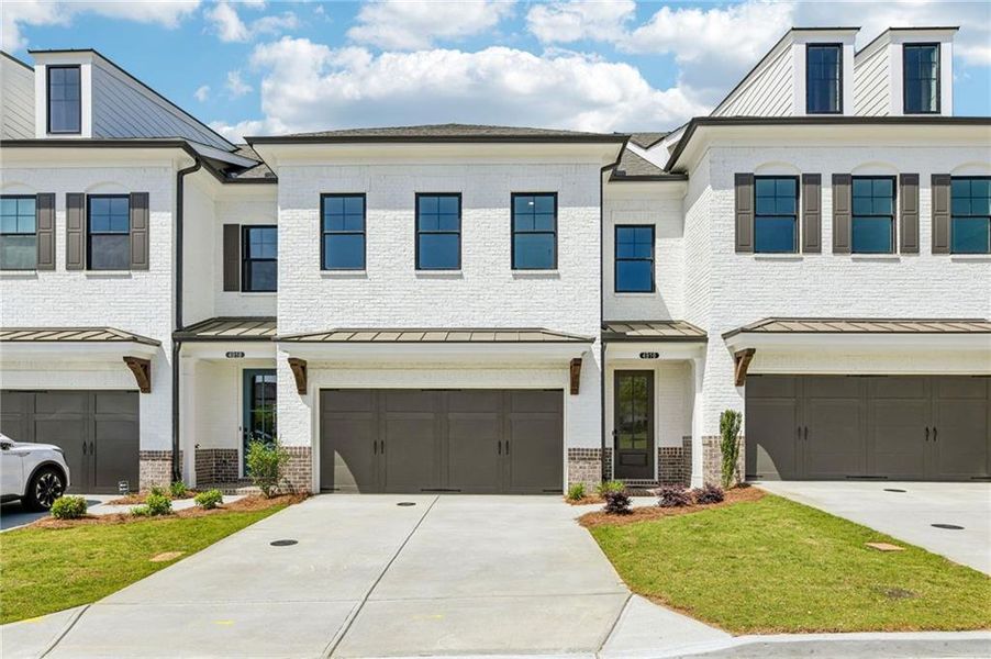 Front exterior of a new home in Millcroft Townhomes, Buford, GA, highlighting curb appeal (Image 2). Front exterior of a new home in Millcroft Townhomes, Buford, GA, highlighting curb appeal (Image 2).