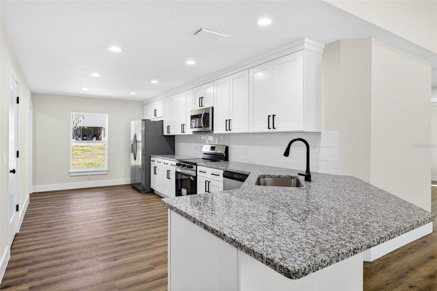 Furnished interior view inside a new home in , Dade City (Image 6).