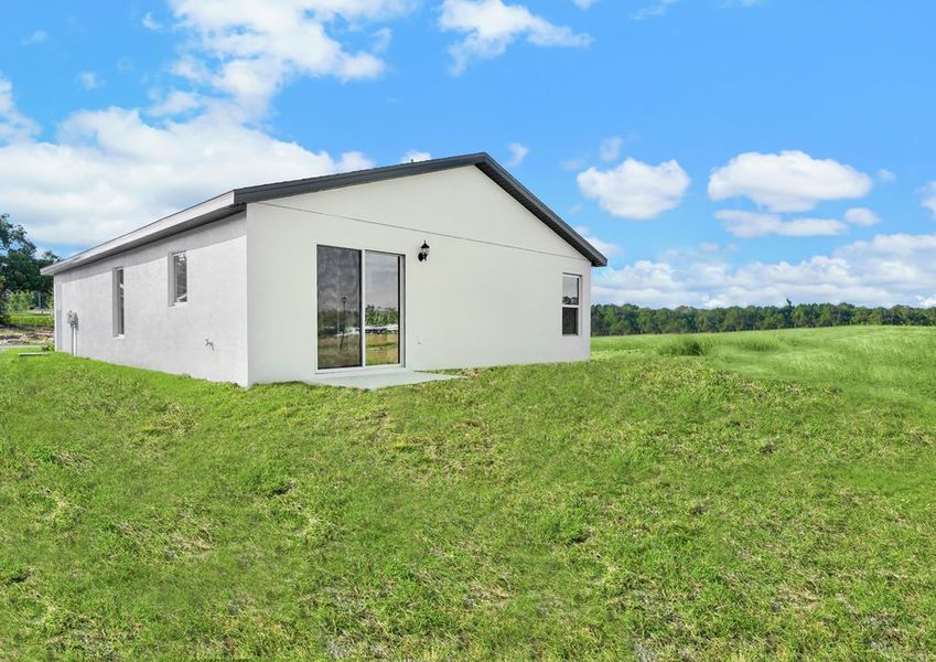 The Alafia plan includes glass sliding doors connecting the back yard to the home.