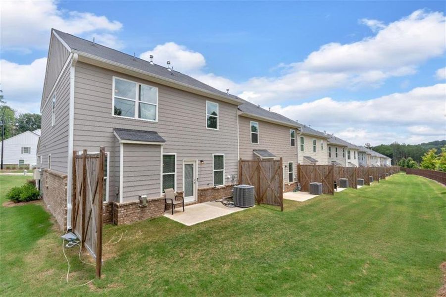 Exterior details and patio area of a home in Park Center Pointe, Austell (Image 29).