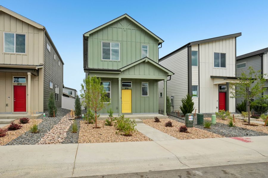 Front exterior of a new home in Liberty Draw, Evans, CO, highlighting curb appeal (Image 23).