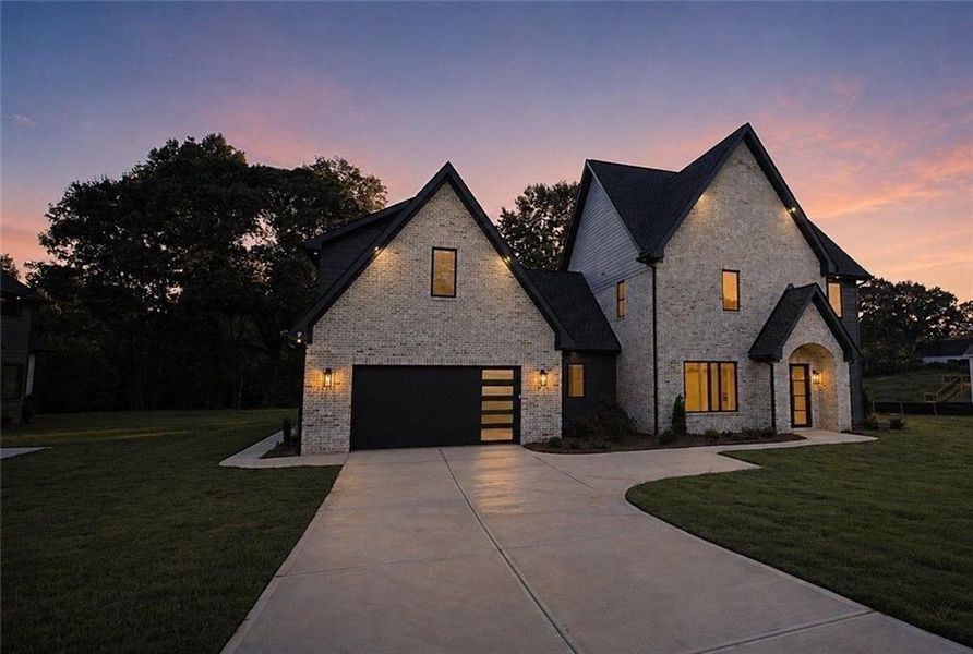 Front exterior of a new home in , Flowery Branch, GA, highlighting curb appeal (Image 2). Front exterior of a new home in , Flowery Branch, GA, highlighting curb appeal (Image 2).