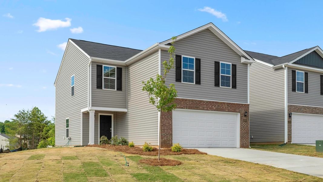 Front exterior of a new home in Willow Mill, Thomasville, NC, highlighting curb appeal (Image 2). Front exterior of a new home in Willow Mill, Thomasville, NC, highlighting curb appeal (Image 2).