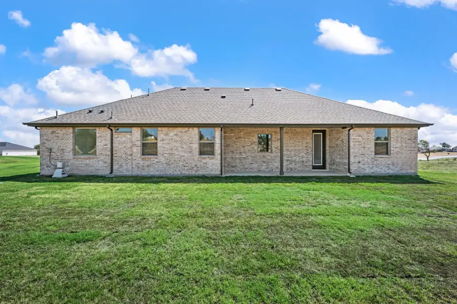 Exterior details and patio area of a home in Gatlin Ranch, Springtown (Image 23).