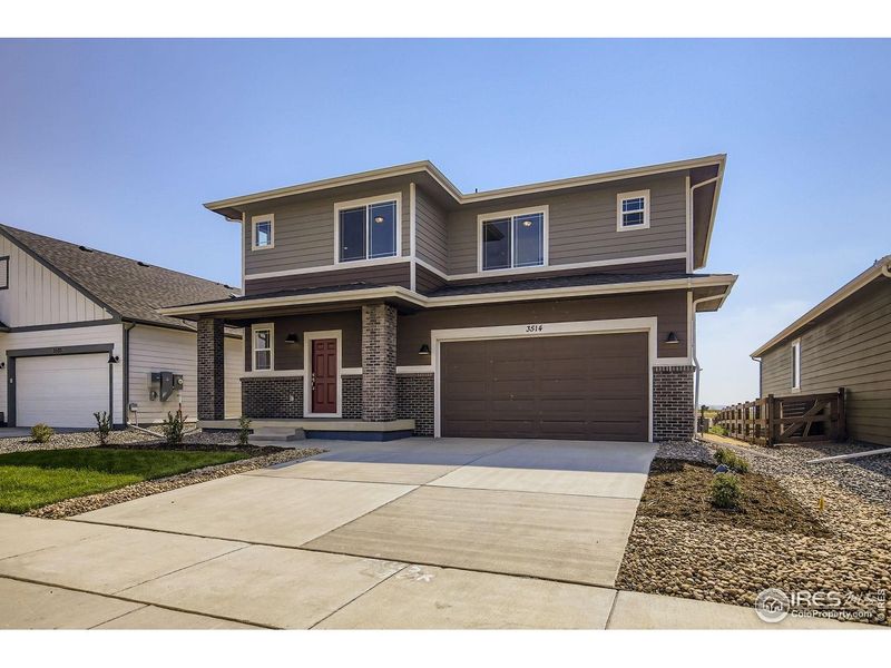 Front exterior of a new home in Country Club Reserve, Fort Collins, CO, highlighting curb appeal (Image 1). Front exterior of a new home in Country Club Reserve, Fort Collins, CO, highlighting curb appeal (Image 1).