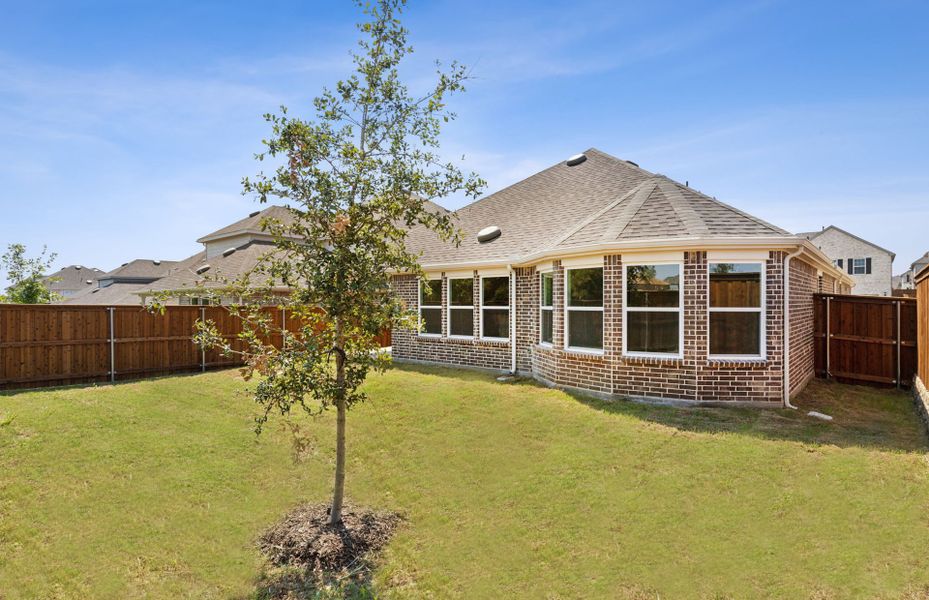 Spacious backyard with covered patio