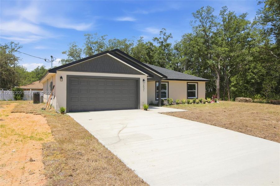 Front exterior of a new home in , Avon Park, FL, highlighting curb appeal (Image 18). Front exterior of a new home in , Avon Park, FL, highlighting curb appeal (Image 18).