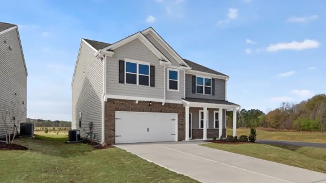 Front exterior of a new home in The Landing at Winston Pointe, Clayton, NC, highlighting curb appeal (Image 2). Front exterior of a new home in The Landing at Winston Pointe, Clayton, NC, highlighting curb appeal (Image 2).