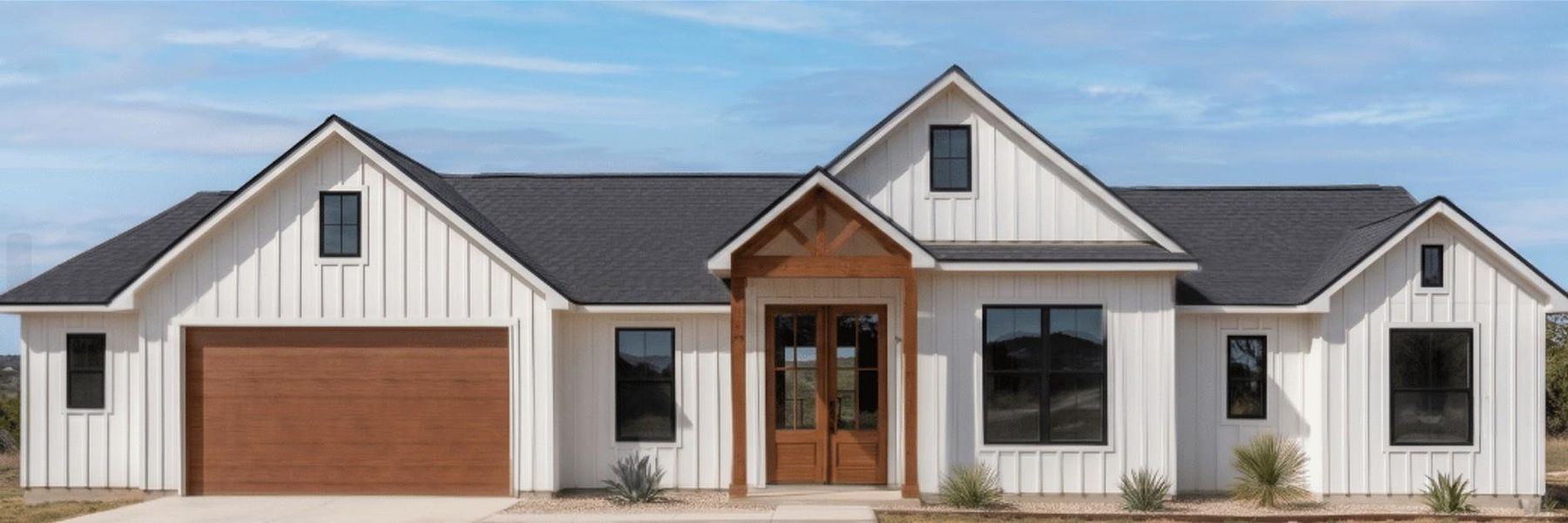 White board and batten siding with black framed windows creates a charming farmhouse exterior. White board and batten siding with black framed windows creates a charming farmhouse exterior.