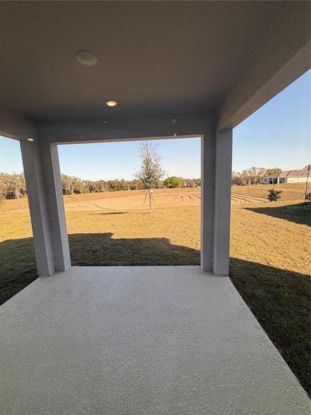 Exterior details and patio area of a home in Eagletail Landings, Howey-in-the-Hills (Image 3).