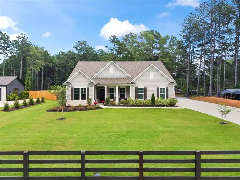 Front exterior of a new home in , Monroe, GA, highlighting curb appeal (Image 24). Front exterior of a new home in , Monroe, GA, highlighting curb appeal (Image 24).