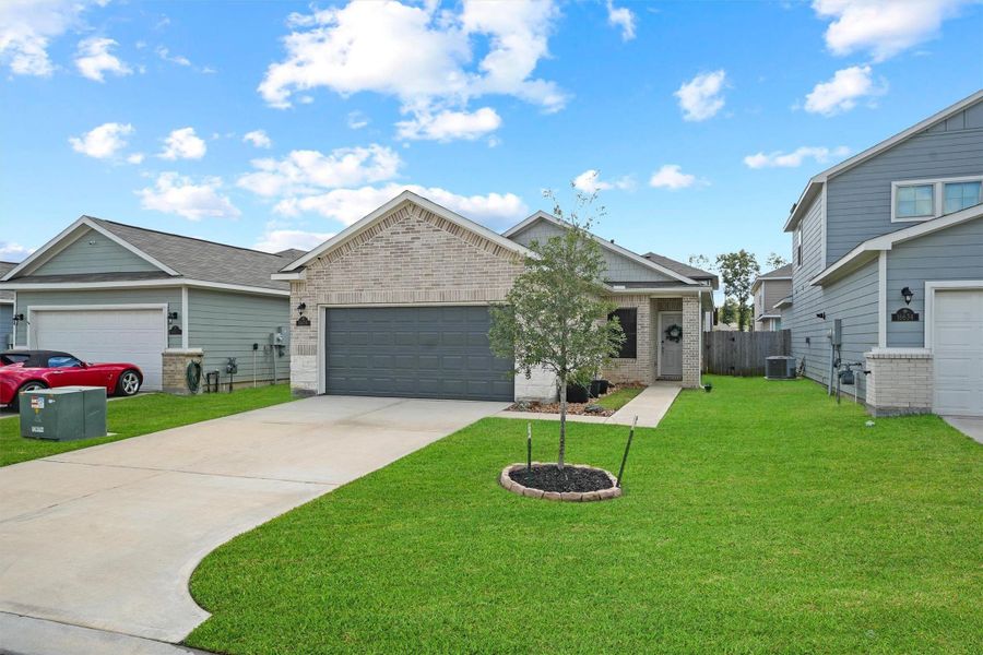 Front exterior of a new home in Maple Heights, Porter, TX, highlighting curb appeal (Image 1). Front exterior of a new home in Maple Heights, Porter, TX, highlighting curb appeal (Image 1).