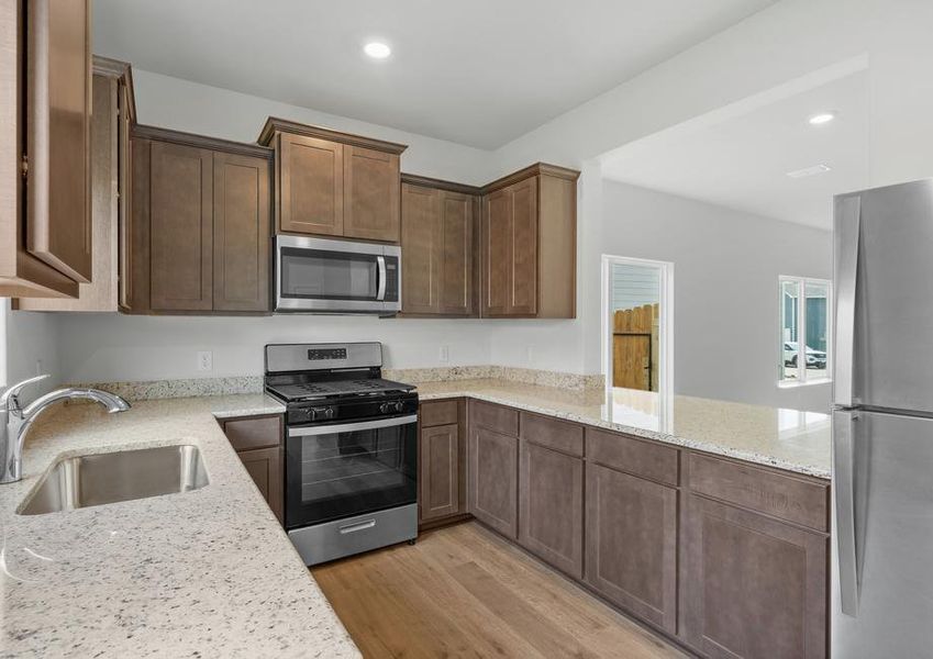 The kitchen has sprawling granite countertops.