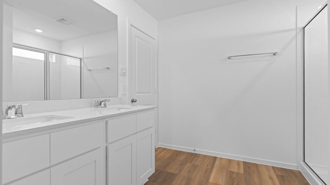 Representative furnished interior of a home built from the Bellvue by D.R. Horton in Watermark, Alvin (Image 7).