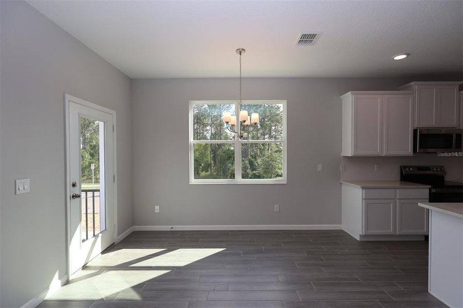 Spacious, unfurnished interior of a new home in Tribute at Ovation, Winter Garden (Image 11).