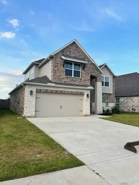 Front exterior of a new home in Morton Creek Ranch, Katy, TX, highlighting curb appeal (Image 2). Front exterior of a new home in Morton Creek Ranch, Katy, TX, highlighting curb appeal (Image 2).