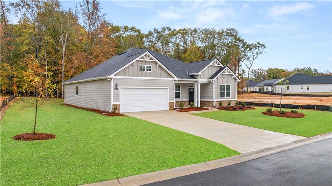 Front exterior of a new home in Kingston Ranch at Lake Oconee, Buckhead, GA, highlighting curb appeal (Image 17). Front exterior of a new home in Kingston Ranch at Lake Oconee, Buckhead, GA, highlighting curb appeal (Image 17).