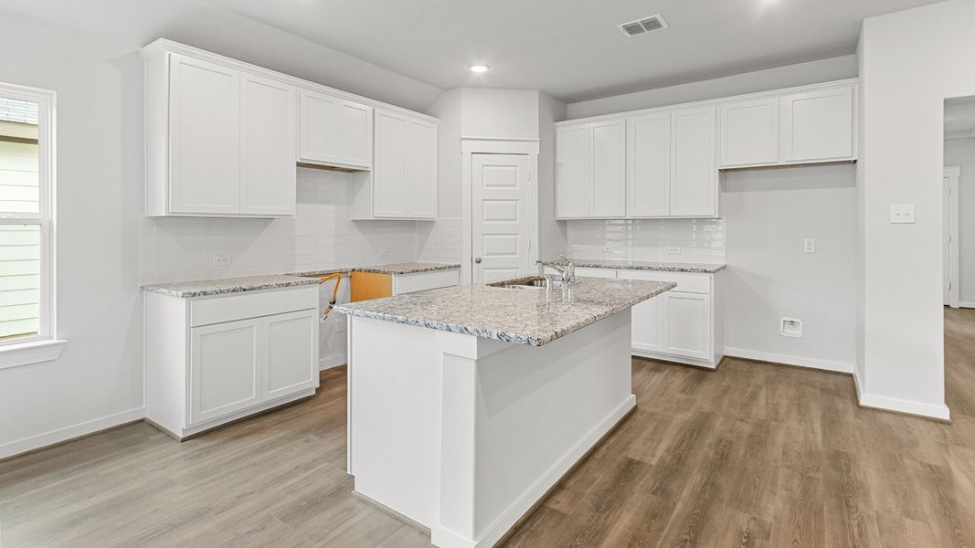 Representative furnished interior of a home built from the Kimbell by Brightland Homes in Sunterra, Katy (Image 7).