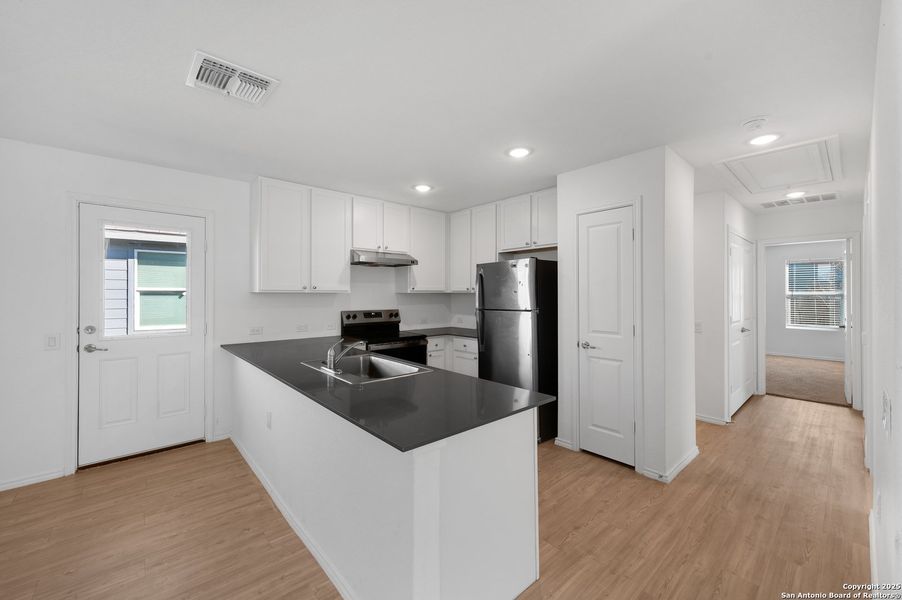 Furnished interior view inside a new home in , San Antonio (Image 10).