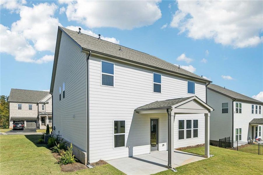 Exterior details and patio area of a home in East Harbor II at Chestatee, Dawsonville (Image 23).