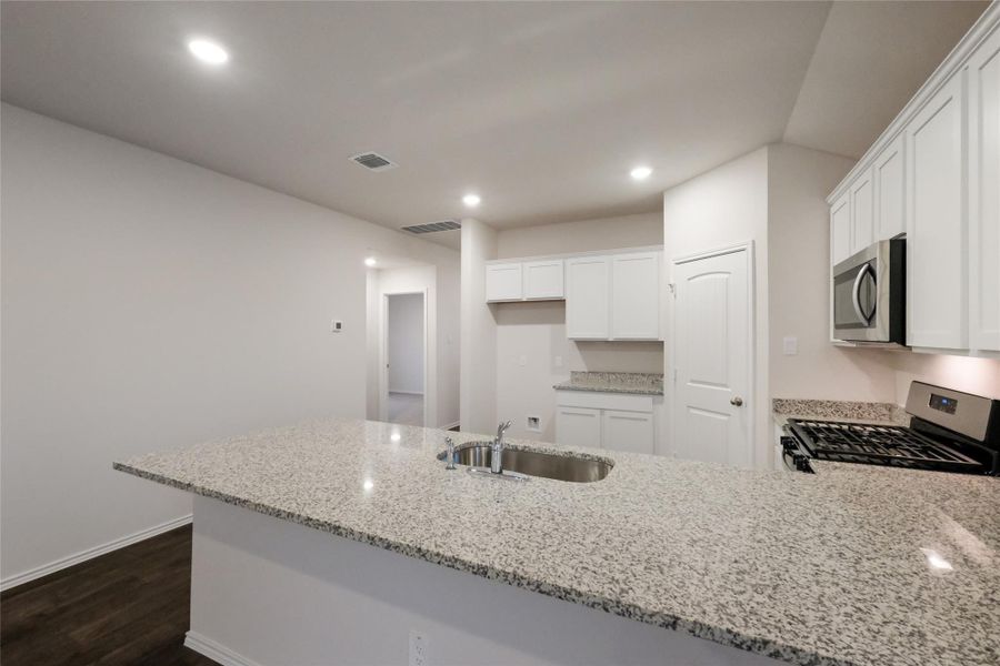 Furnished interior view inside a new home in Watermill, Uhland (Image 6).