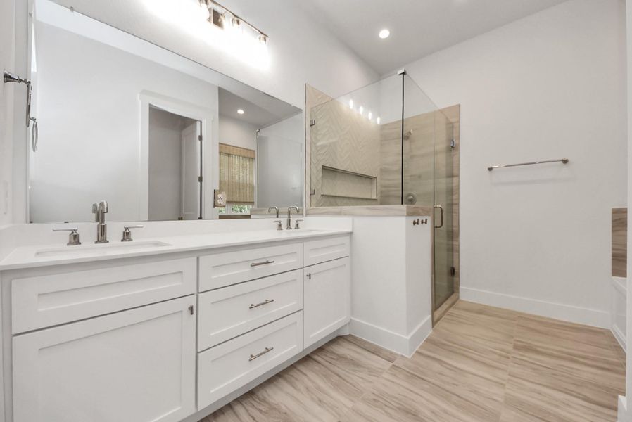 Primary Bathroom featuring modern finishes and a clean design.