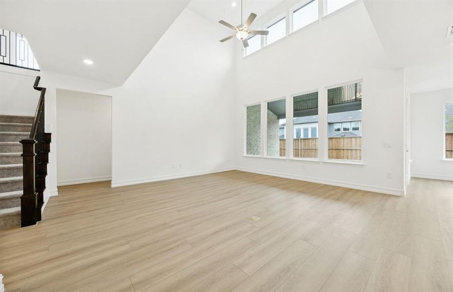 *floorplan representation, not actual home - Spacious gathering room with large windows