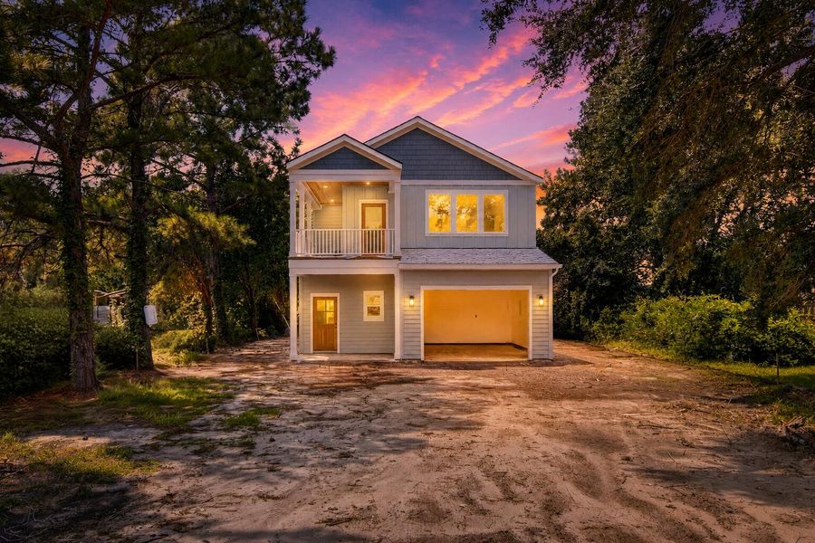 Front exterior of a new home in , Pinopolis, SC, highlighting curb appeal (Image 23). Front exterior of a new home in , Pinopolis, SC, highlighting curb appeal (Image 23).