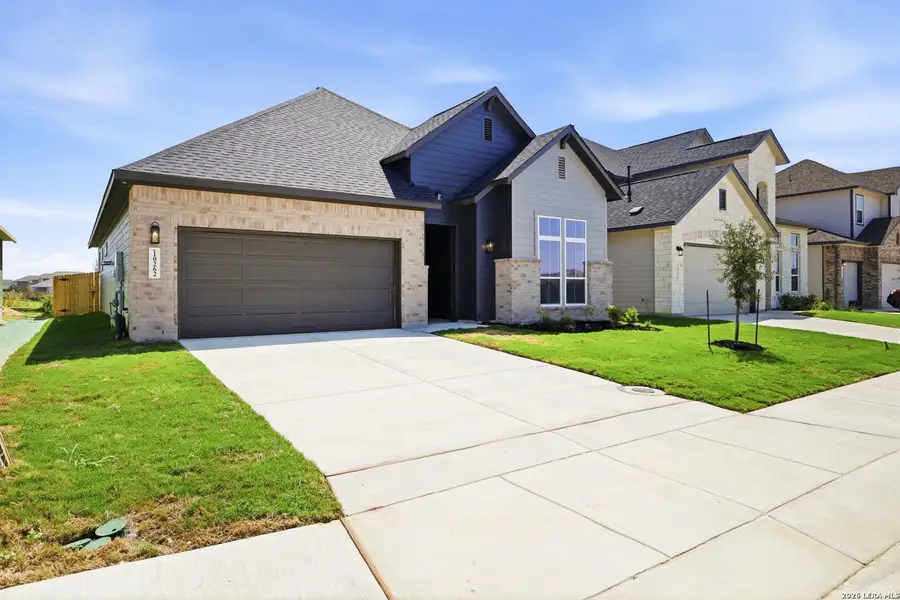 Front exterior of a new home in Rhine Valley, Schertz, TX, highlighting curb appeal (Image 1). Front exterior of a new home in Rhine Valley, Schertz, TX, highlighting curb appeal (Image 1).